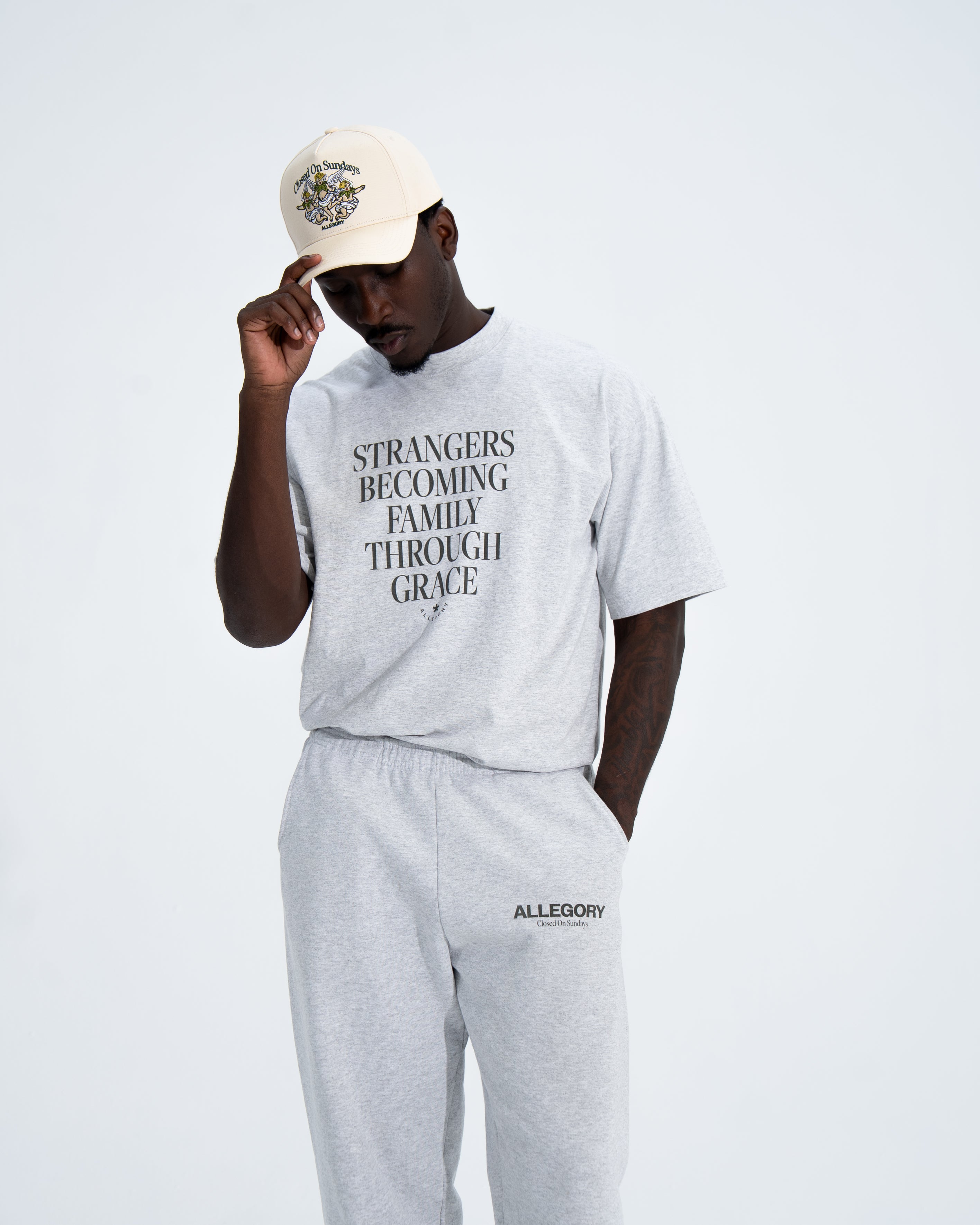 Strangers Becoming Family Through Grace Tee