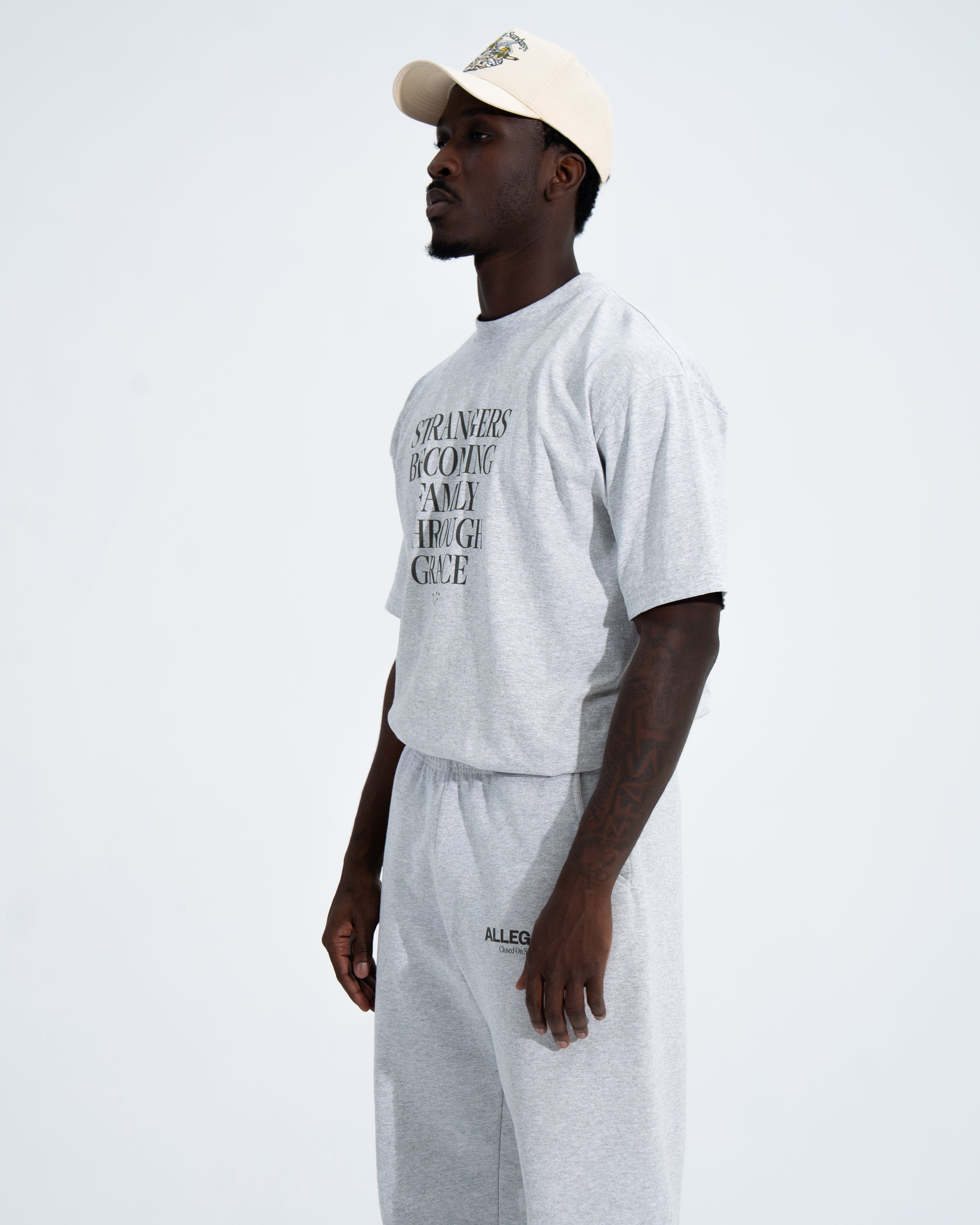 Strangers Becoming Family Through Grace Tee-4