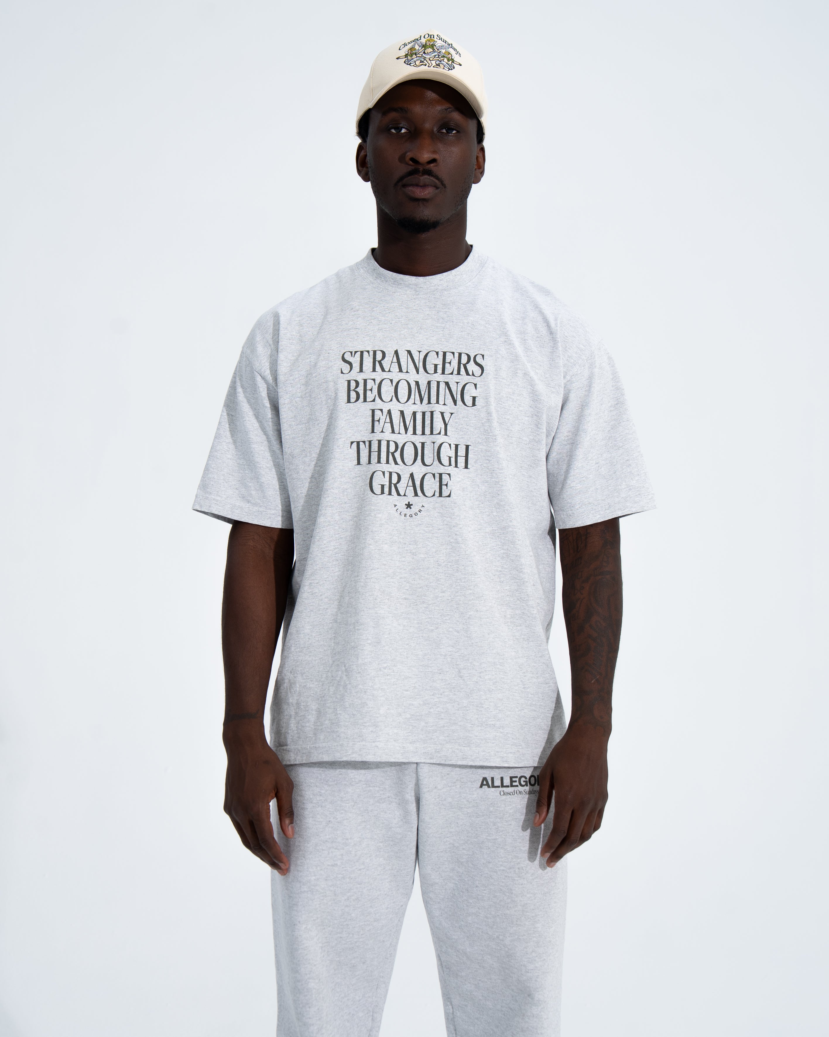 Strangers Becoming Family Through Grace Tee-5